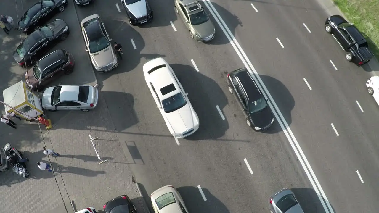 Aerial view of cameraman shooting driving cars