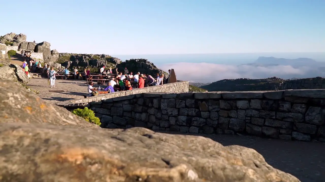 Tourists mingle on the lookout deck on top of Table Mountain in South Africa