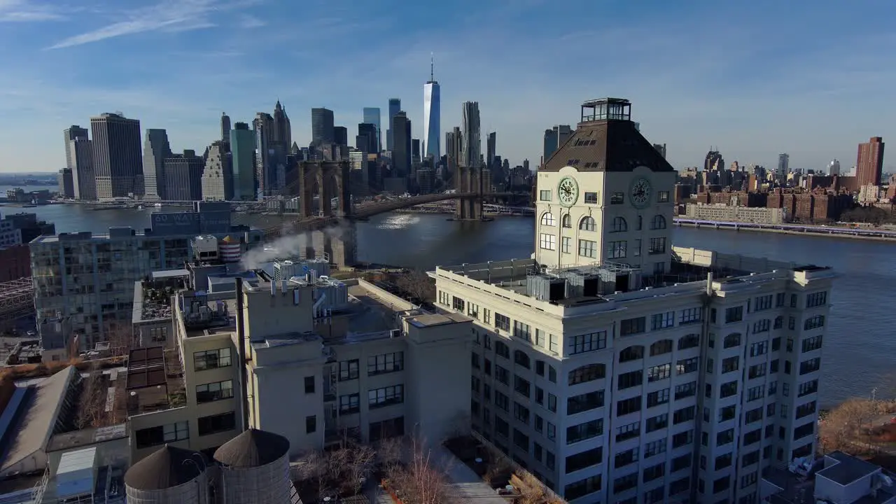 Excellent Aerial Of Dumbo Brooklyn Apartments With Brooklyn Bridge East River And New York City Skyline In Distance