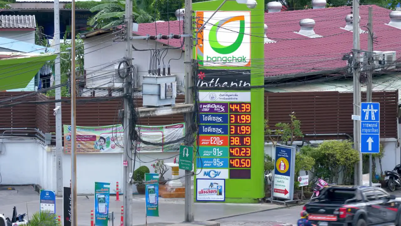 The updated petrol prices displayed on a digital board in front of Bangchak Petrol Station in Bangkok Thailand