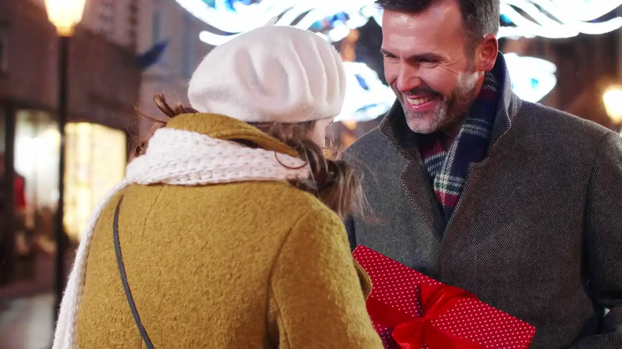 Mature man giving his lady the gift