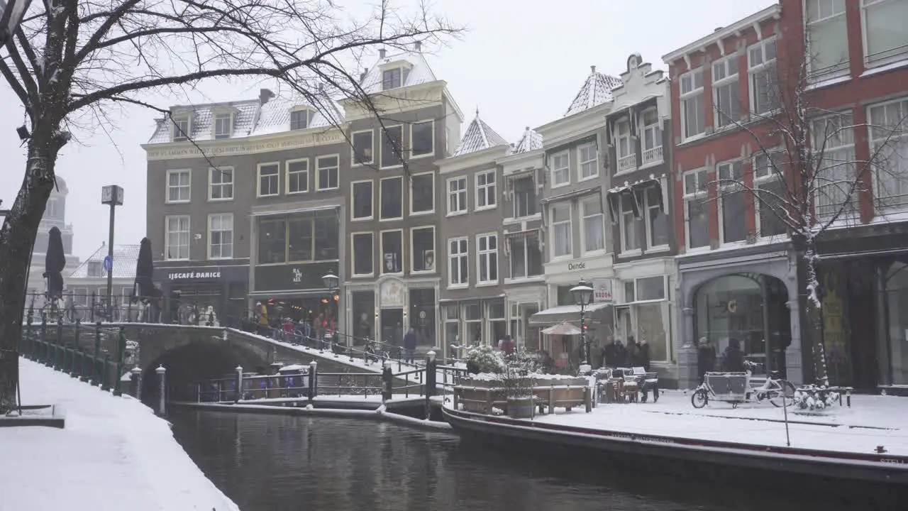 Leiden city centre and Rhine river in winter snow Dutch town winter scene