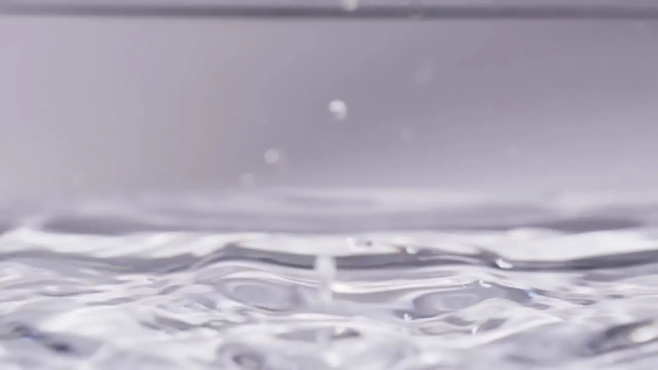 Video of close up of drop of water with copy space on white background