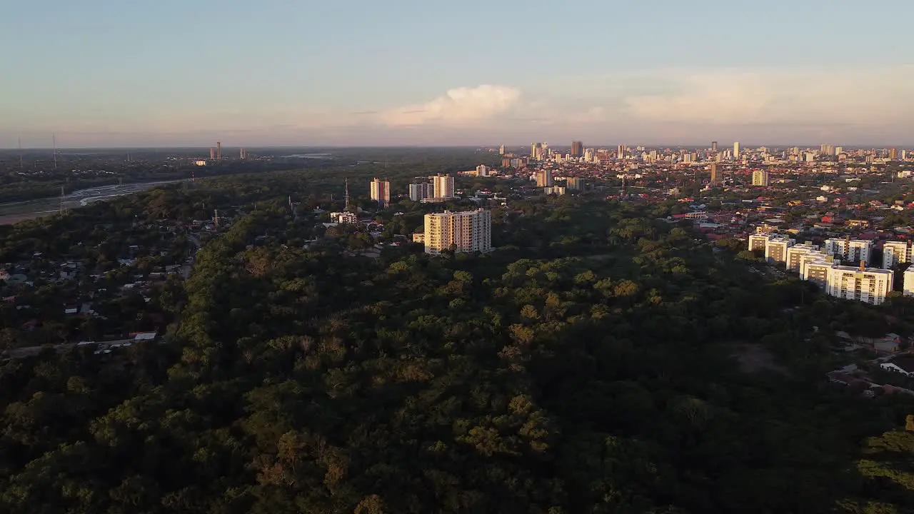 Golden hour aerial rotates over city Santa Cruz de la Sierra Bolivia