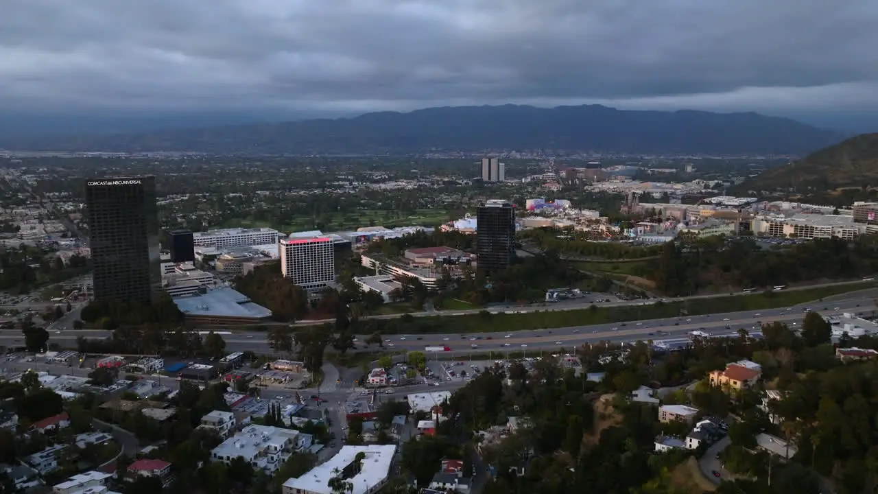 Aerial view approaching the Universal City cloudy evening in San Fernando Valley LA USA