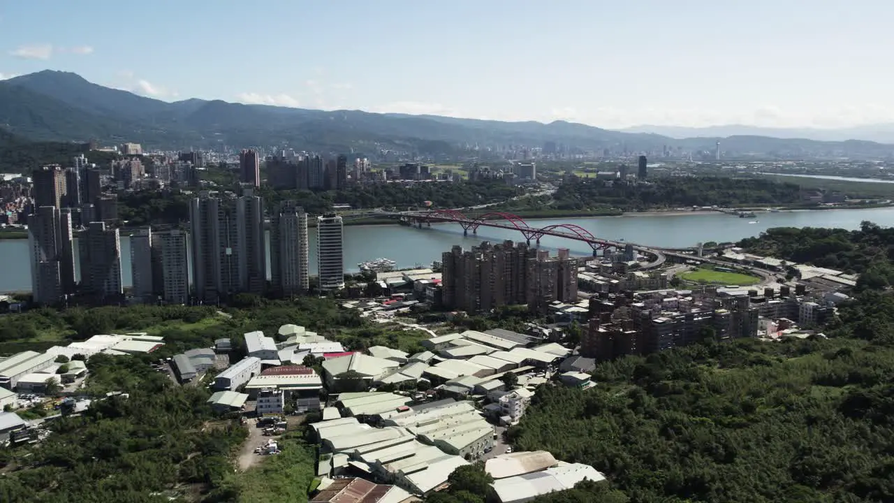 Taipei's cityscape Guandu Bridge and mountains create vibrant aerial spectacle