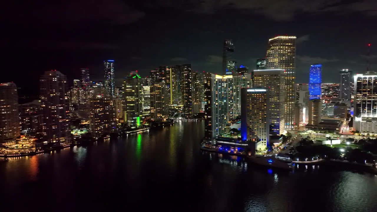 Miami's nighttime allure unfolds in this aerial view capturing the beauty of landmark buildings and the vibrant city