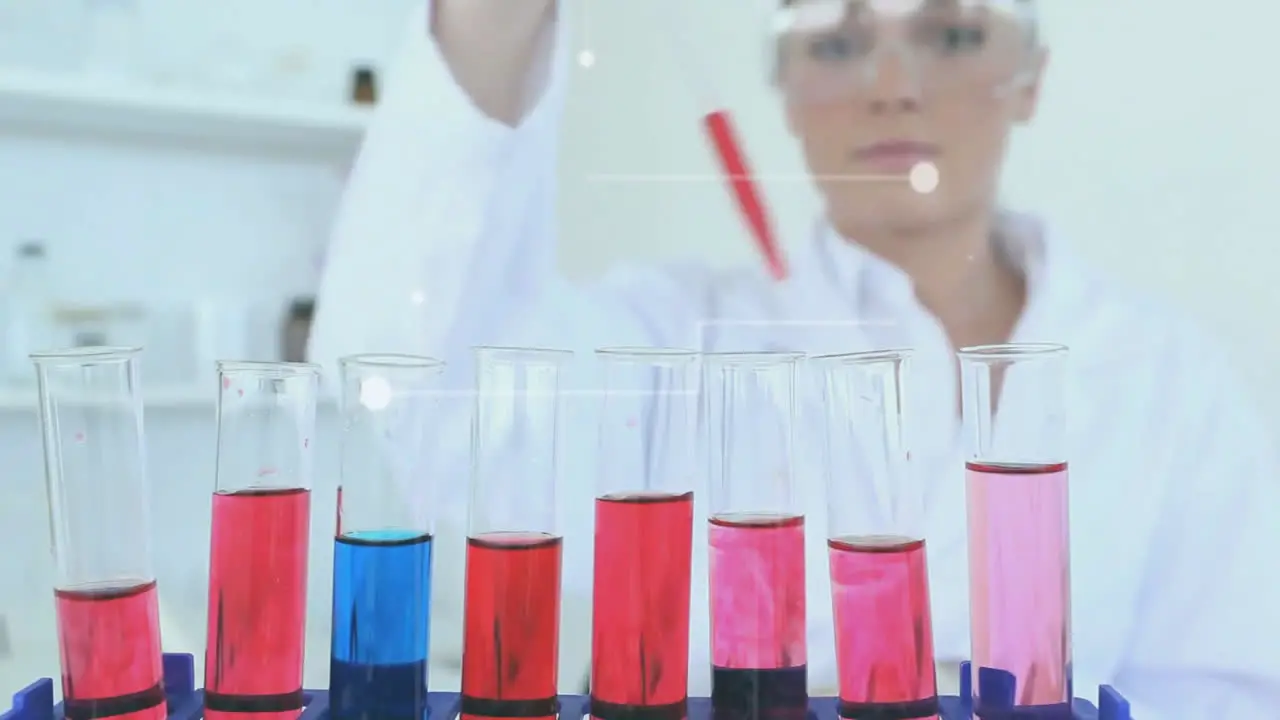 Animation of data network over happy caucasian female scientist mixing chemical solutions in lab