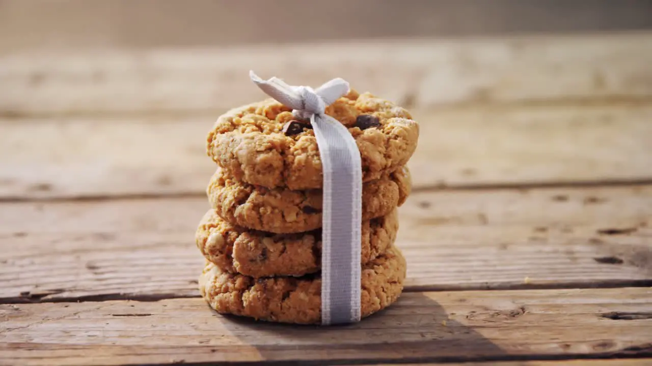 Stack of chocolate cookies tied with ribbon 4k