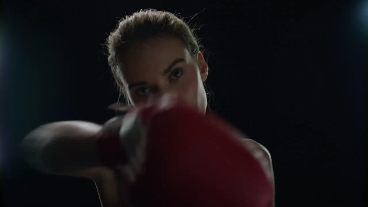 Female boxer training punches