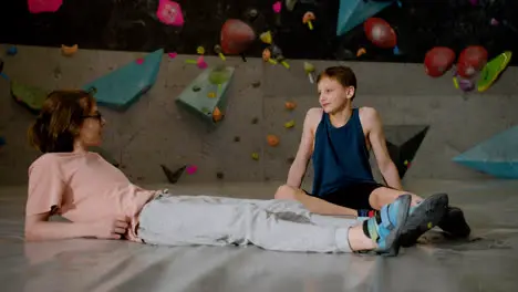 Boys resting in a climbing gym