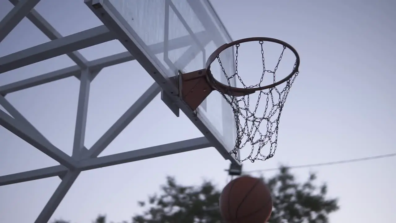 Young Female Basketball Player Plying In The Morning On The Local Court