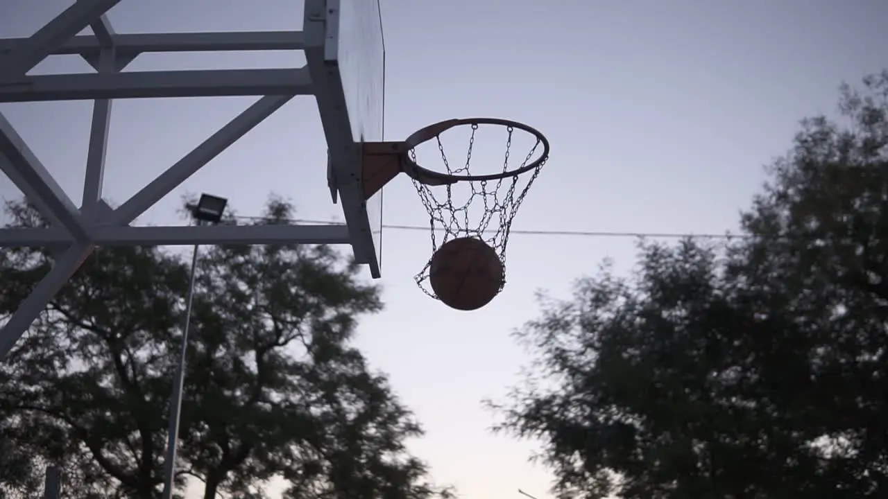 Young Woman Basketball Player Training Outdoors On A Basketball Court