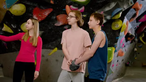 Teenage friends in a climbing gym