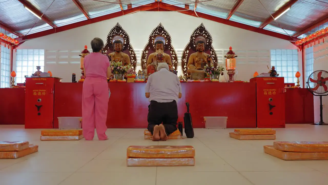 Mid Shot of People Praying in Jakarta