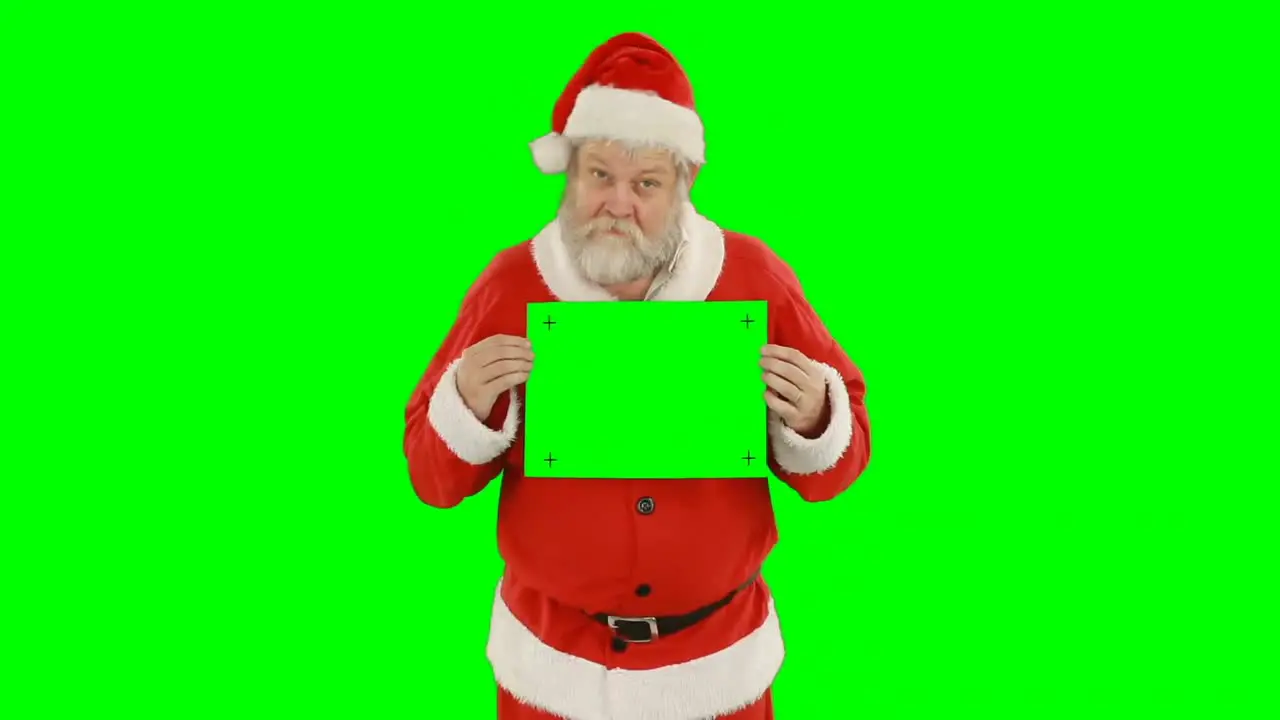 Portrait of santa claus holding blank placard