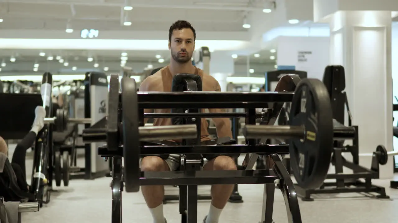 Fit Sporty Man Exercises in Dips Lower Chest Press Machine at Modern Gym Parallax Motion