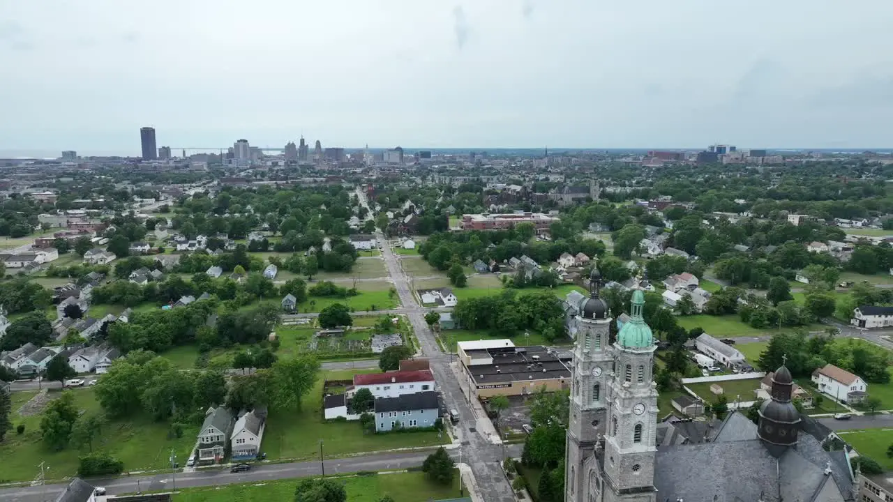 An aerial view of the green city of Buffalo New York with storm clouds in the distance