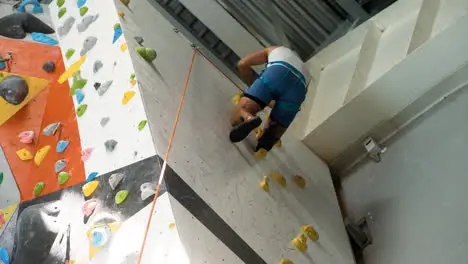 Man in a climbing wall centre