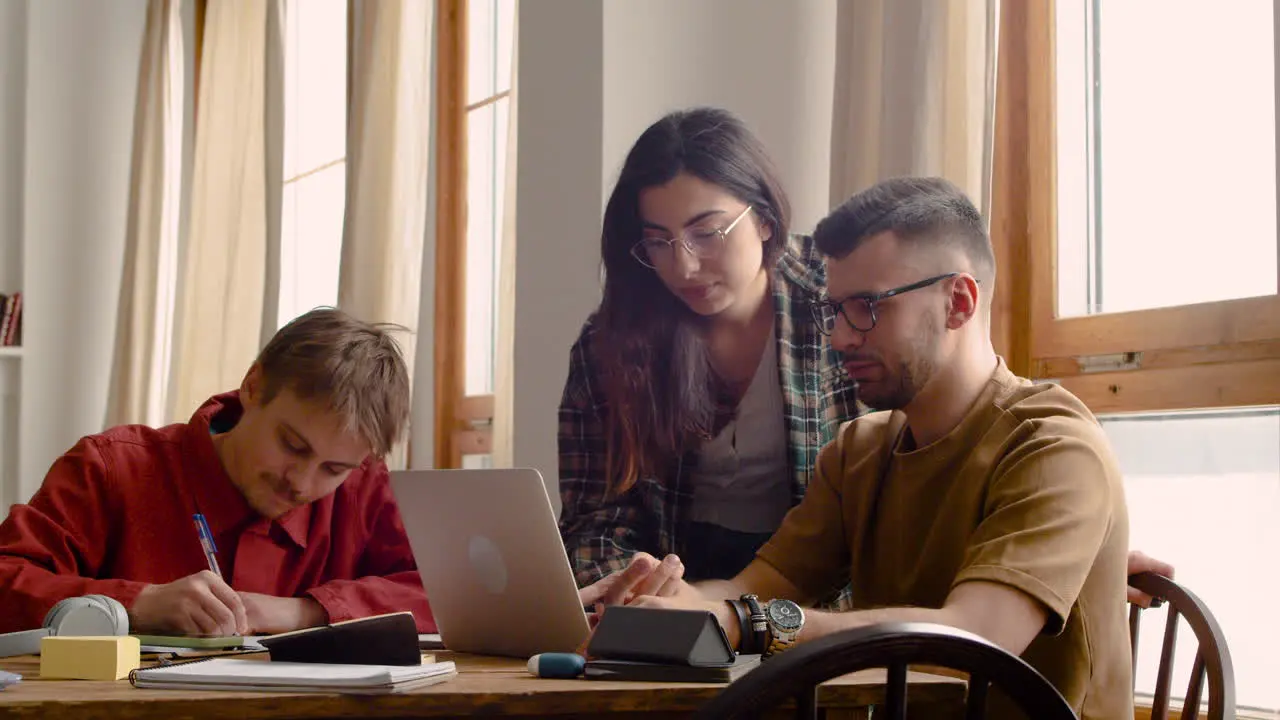 Three Mates Of A Study Group At The Table