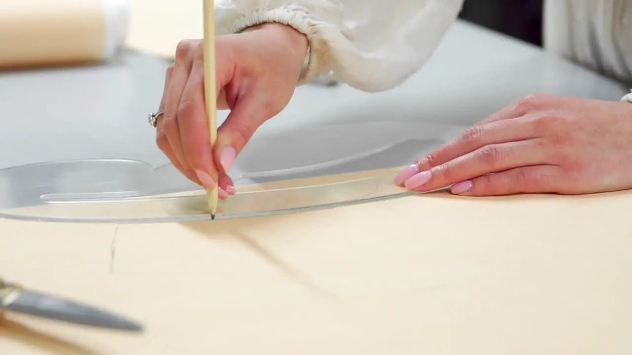 Female fashion designers drawing sketches for clothes in atelier Sequence