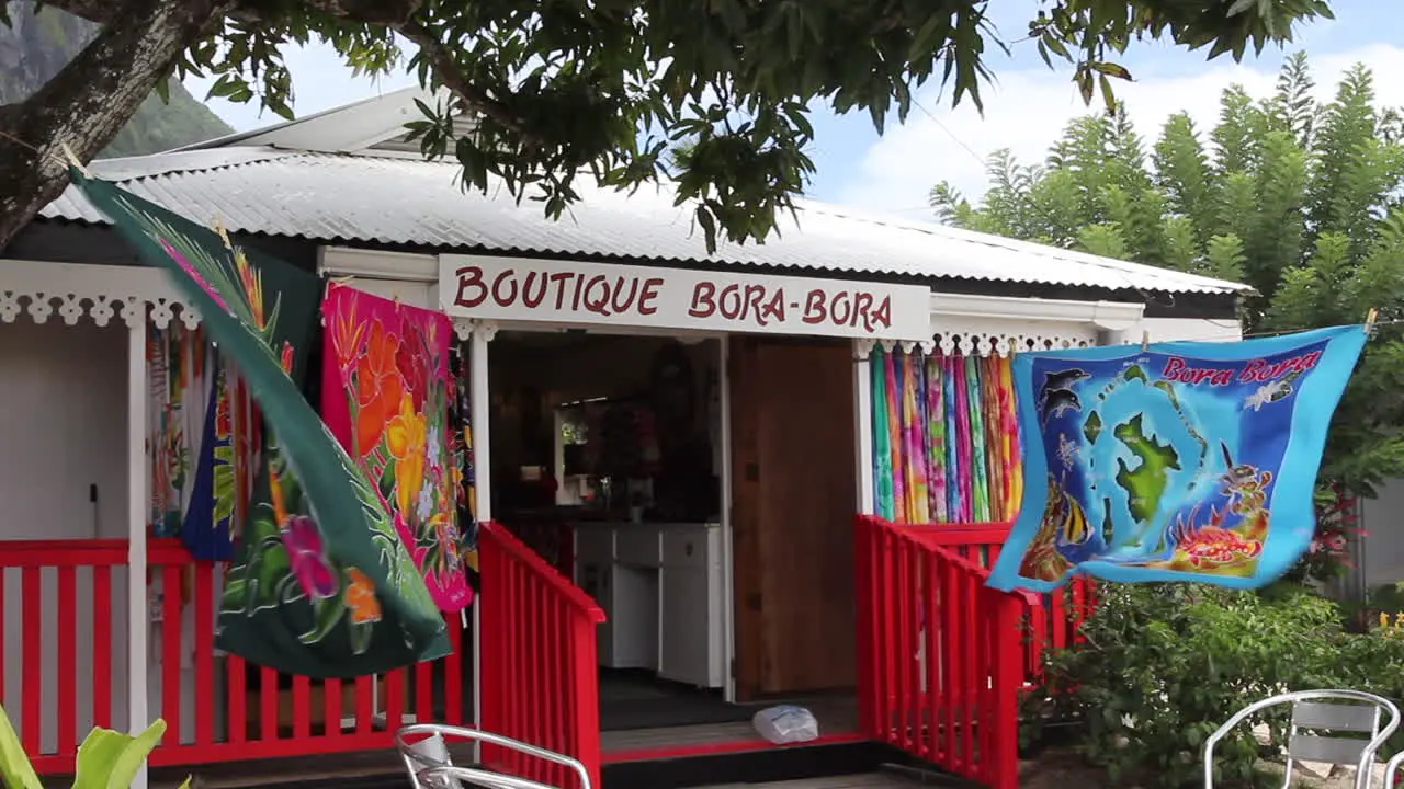 Bora Bora bright colored cloths flap in the breeze in front of a shop