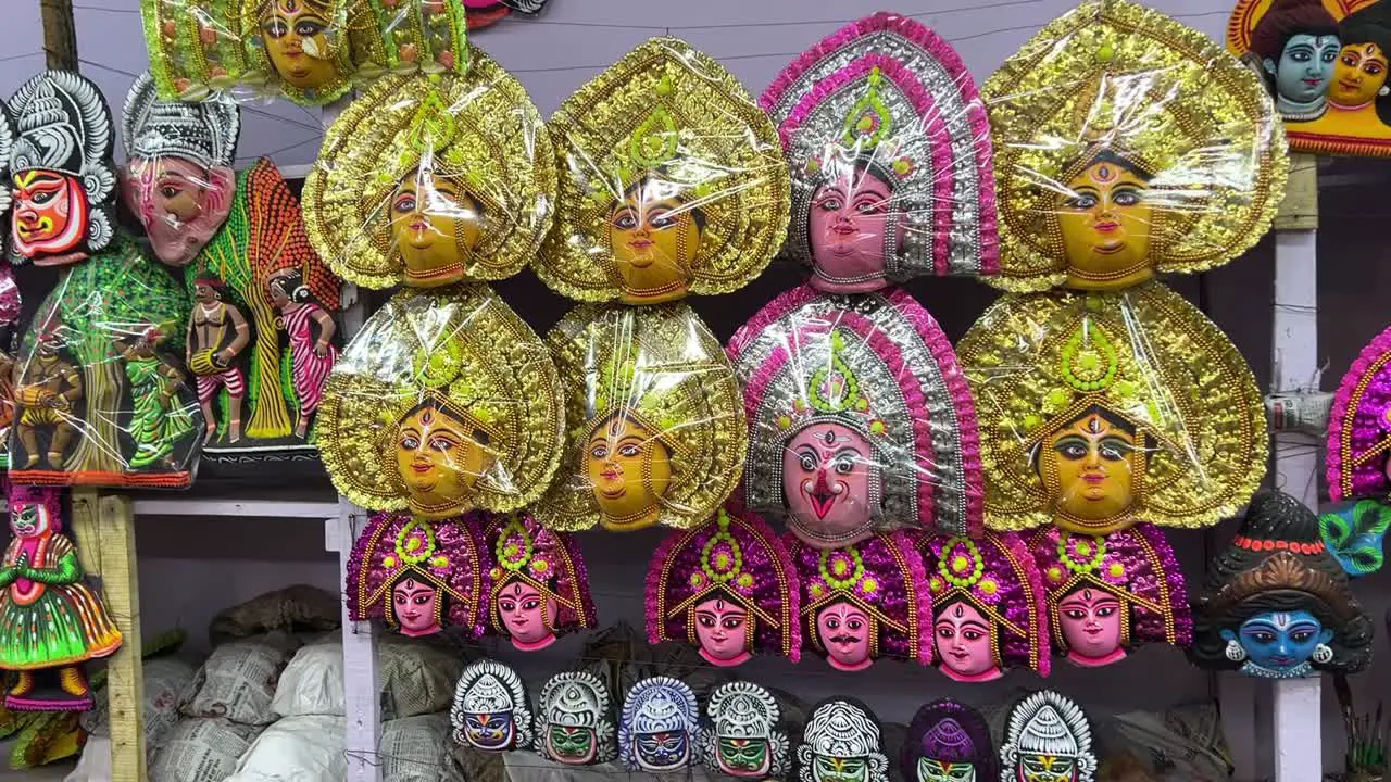 Panorama shot of various facemasks being displayed at roadside stall in Purulia India