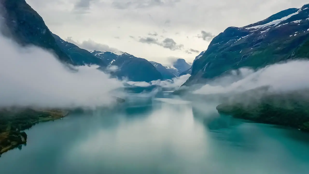 Beautiful Nature Norway natural landscape lovatnet lake flying over the clouds