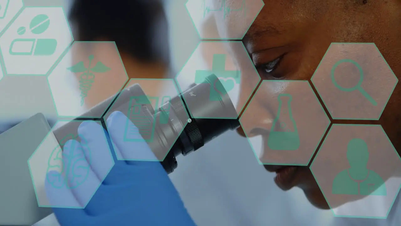 Animation of medical icons against african american female scientist using microscope at laboratory