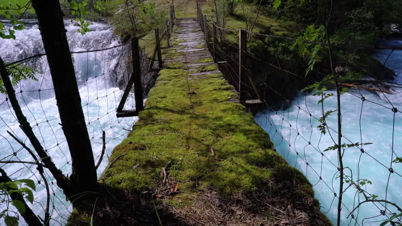 Suspension bridge over the mountain river Norway