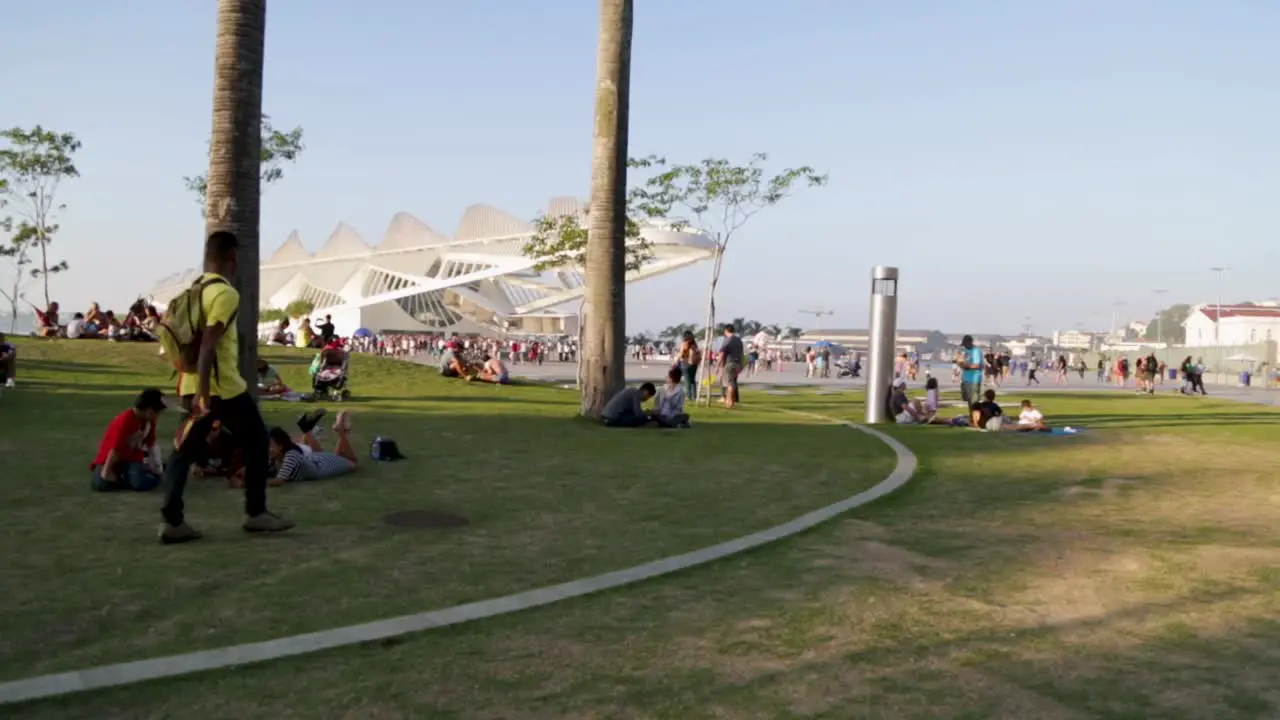 People hanging out with friends in front of Museu do Amanha Tomorrow's museum at Praca Maua in Rio de Janeiro Brazil