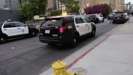 Hollywood Police Vehicles Slowly Moving on Street