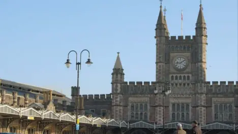 Panning Shot of People Standing In Front of Bristol Temple Meads Station 