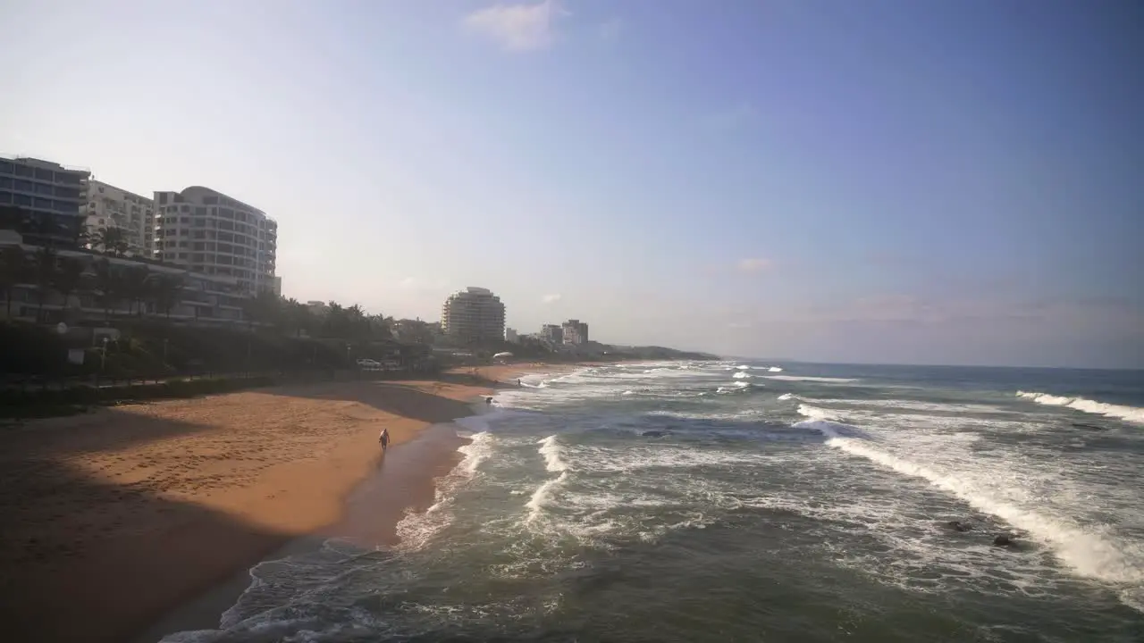 People Walking Down Umhlanga Beach