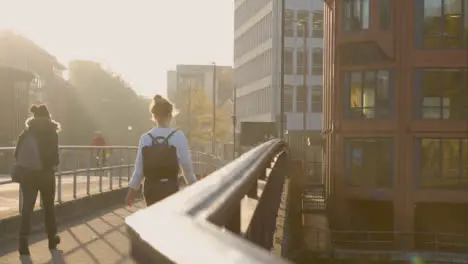 Wide Shot of People Walking Across Bristol Bridge In Bristol England