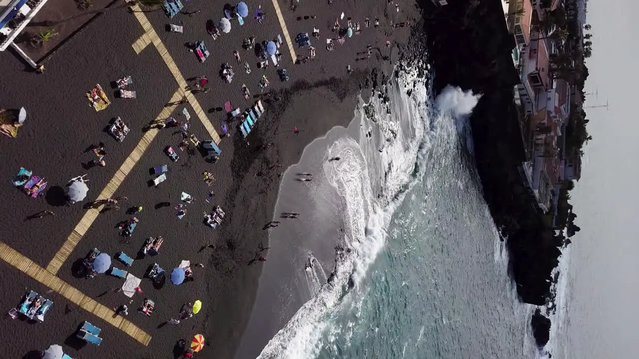 vertical aerial established shot of playa de la arena Tenerife island hot spot travel holiday destination