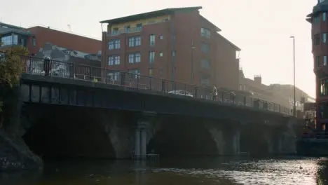 Low Angle Shot of People and Traffic On Bristol Bridge In Bristol England