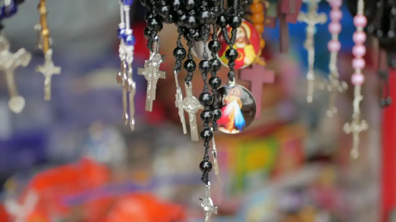 Christian ornaments hanging at showcase exhibition for sale market festive atmosphere and religious holidays concept