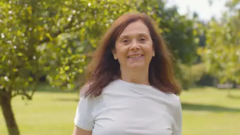 Senior Woman Portrait In Lush Gardens 01