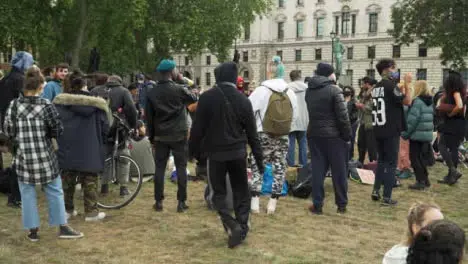 London Male Activist Dancing to Music in Park