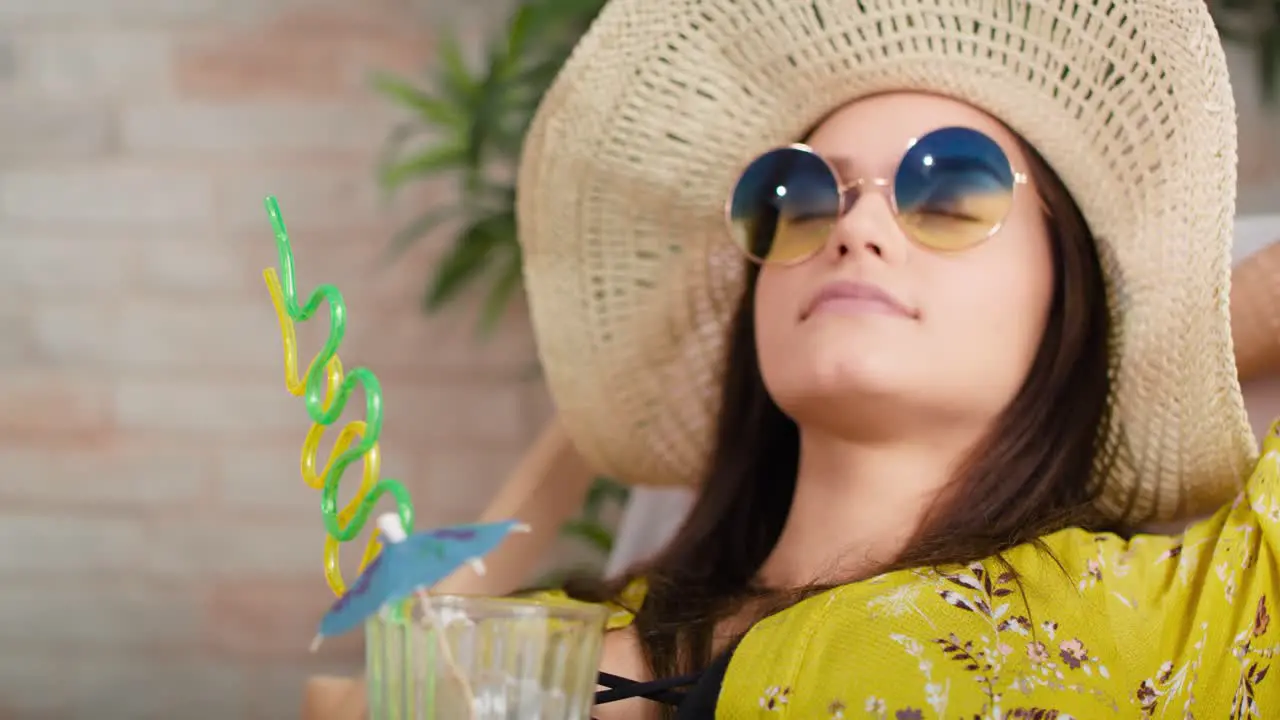 Close up video of woman relaxing on the beach at home