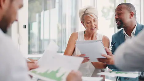 Teamwork documents and business people in meeting