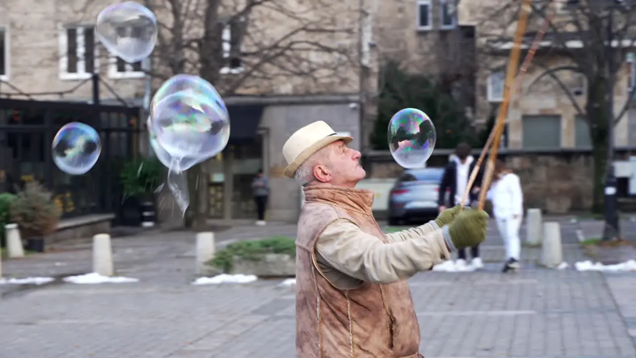 Bubbles made by street artist on the streets of Santa Domenica Cathedral