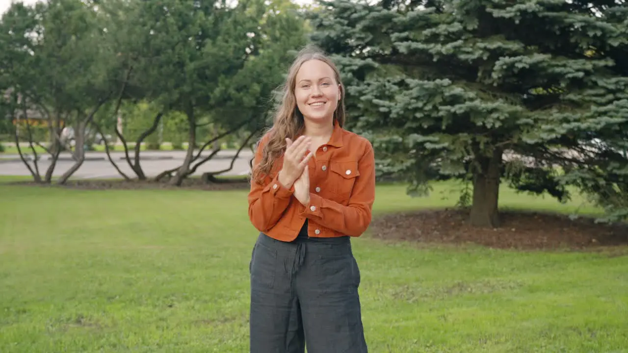 Casual happy woman clapping front view