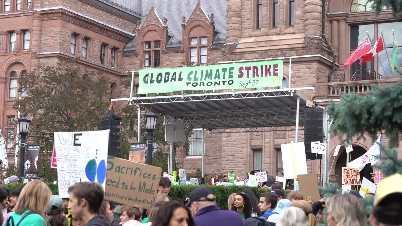 Crowds protesting climate change Queens Park