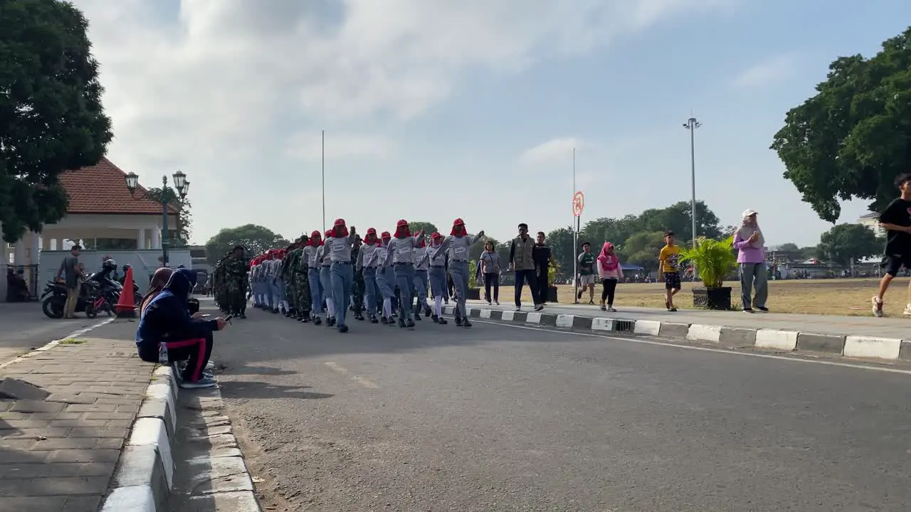 Rows of Indonesian soldiers and students  training to prepare for Indonesia's independence celebrations