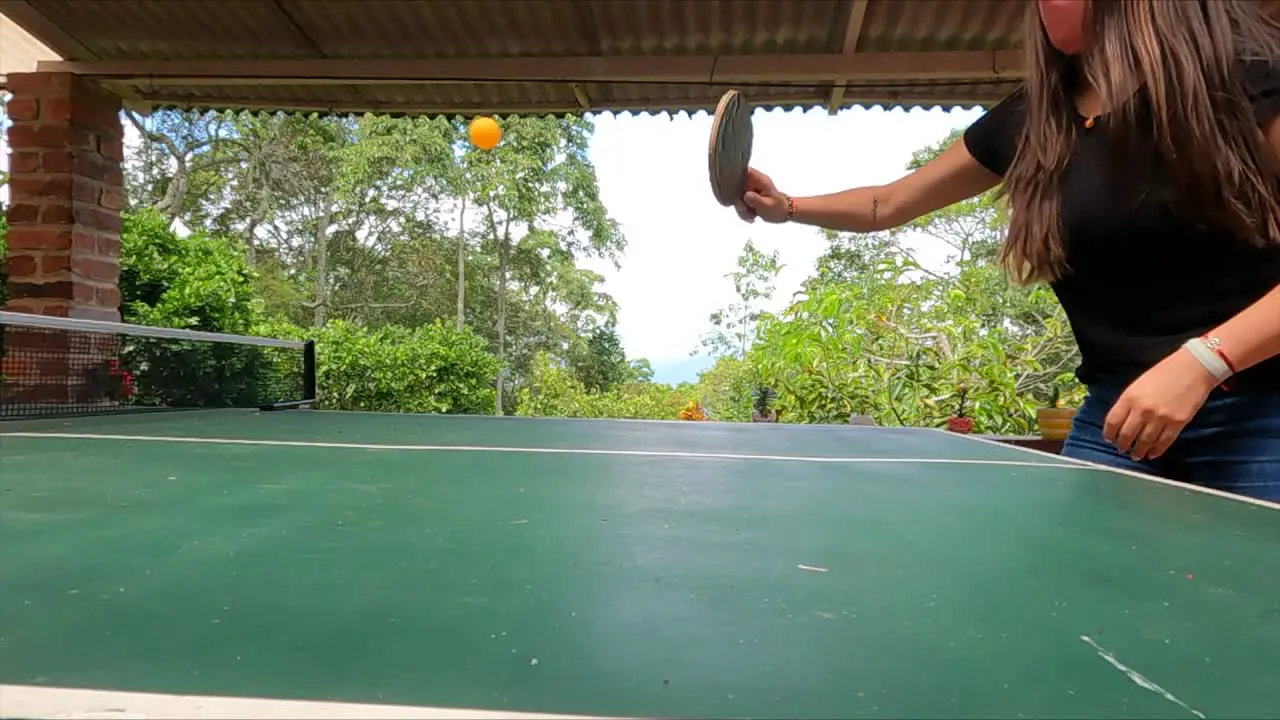 Woman play ping pong outdoors in Bogota  Colombia