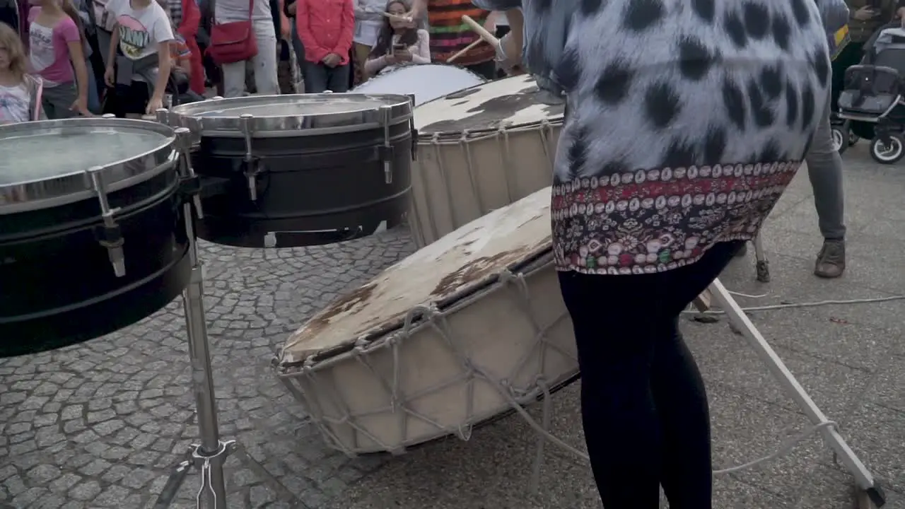 Street drummers in Malbork teaching kids how to play drums