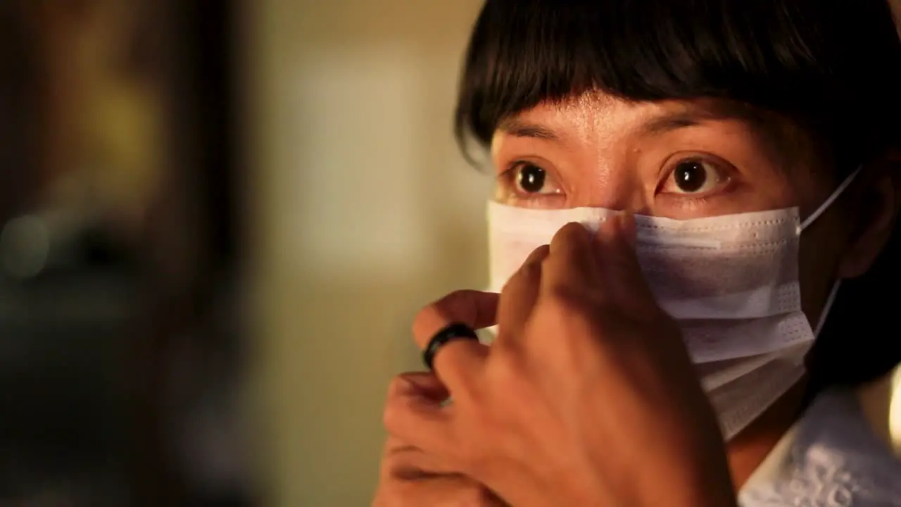 Nurse at the Parque das Tribos community for indigenous people puts on a face mask before treating COVID-19 patients