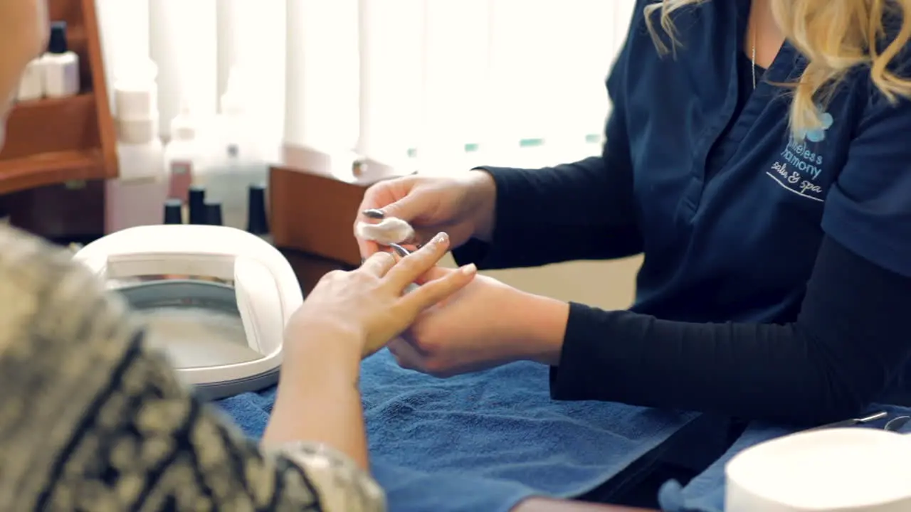 Woman getting a manicure at the spa